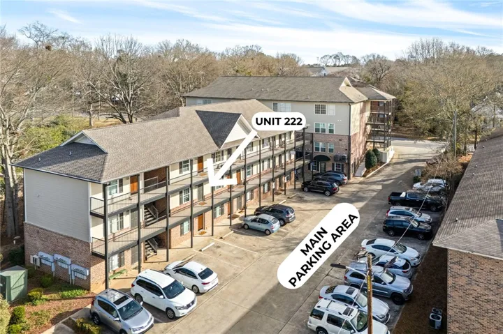 Multi-level residential building offering ample on-site parking for residents and guests.