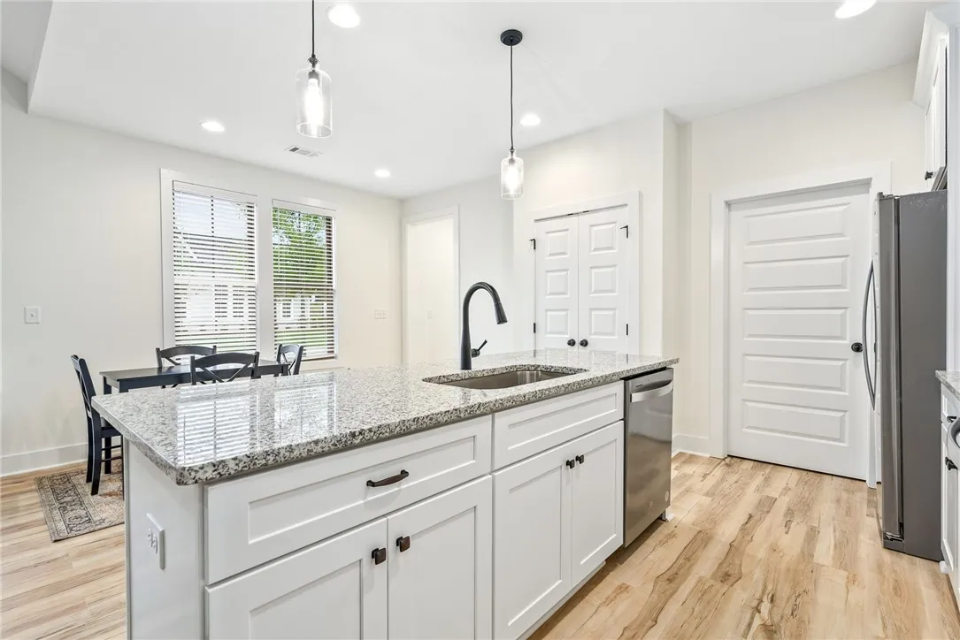 A well-appointed kitchen island with sleek finishes awaits culinary adventures and entertaining.