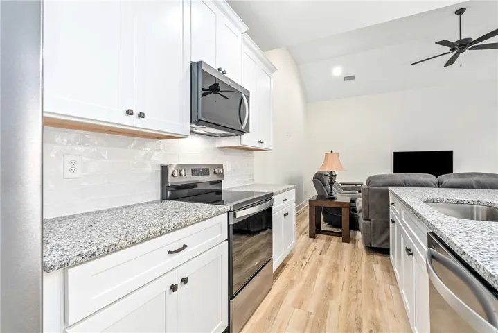 An open-concept living space with a contemporary kitchen and inviting family room.