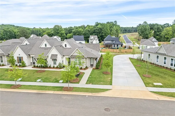 Lush landscaping complements the modern facades of these charming new community homes.