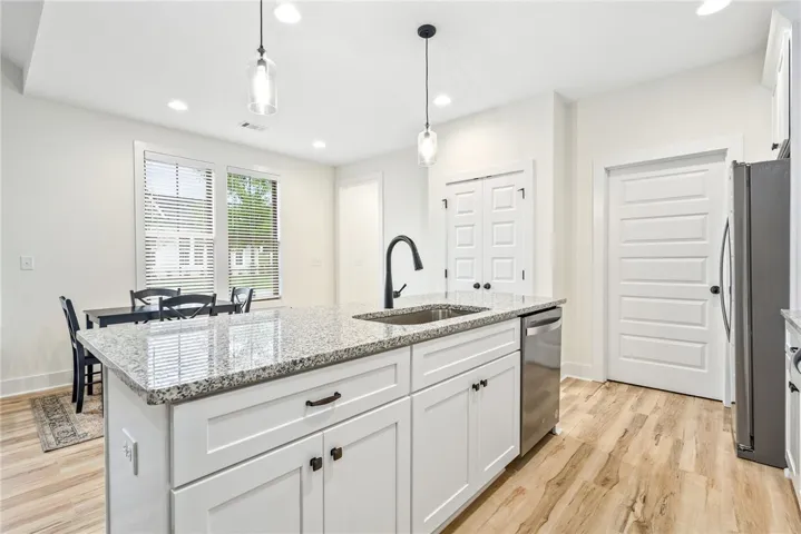 A well-appointed kitchen island with sleek finishes awaits culinary adventures and entertaining.