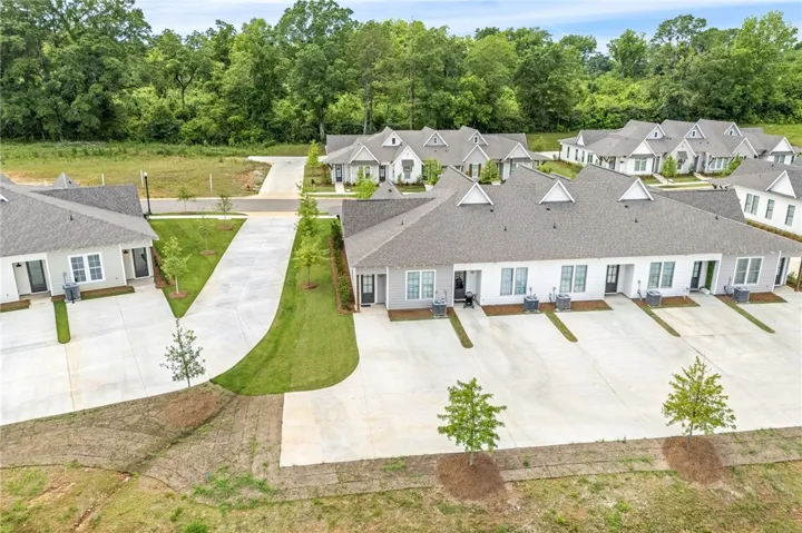 Rows of well-maintained homes with uniform architecture and verdant green spaces create an inviting community.