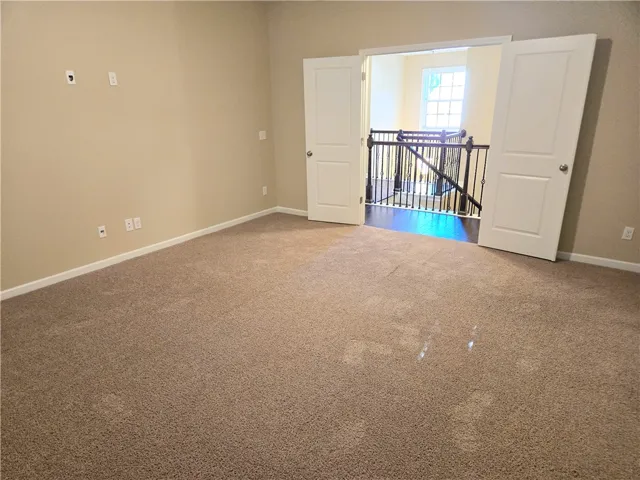 A versatile bonus room awaits, offering ample space and direct access to the elegant staircase.