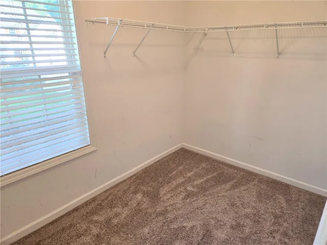 Ample storage solutions in this well-appointed closet, ready for customization.