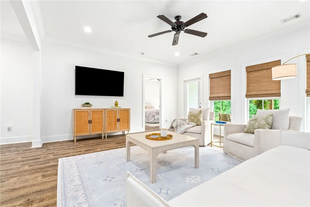 Hardwood floors and bright windows define this inviting living space.