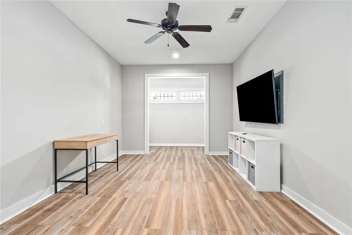 A versatile open-concept room with durable flooring awaits personalization.