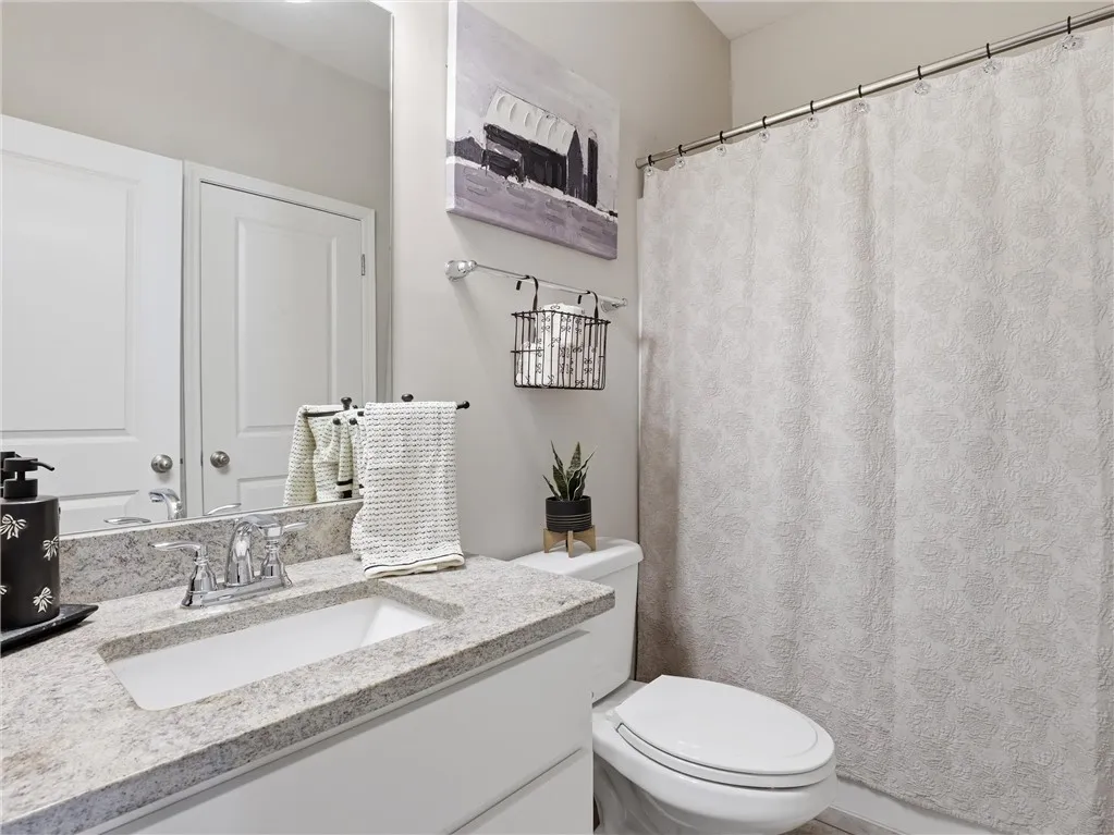 Granite counters complement the clean lines of this thoughtfully designed bathroom.