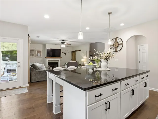 An inviting open-concept space features a well-appointed kitchen island, perfect for entertaining.