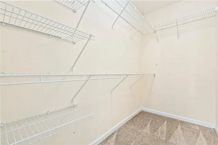Discover optimal organization in this thoughtfully designed walk-in closet.