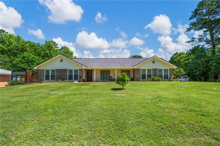 A classic ranch home nestled amidst verdant lawns and mature trees.