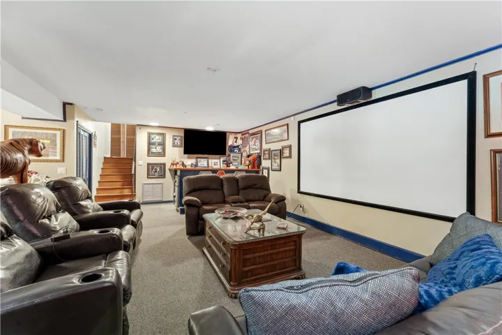 A well-appointed recreation room features a built-in bar, providing an ideal setting for gatherings and entertainment.