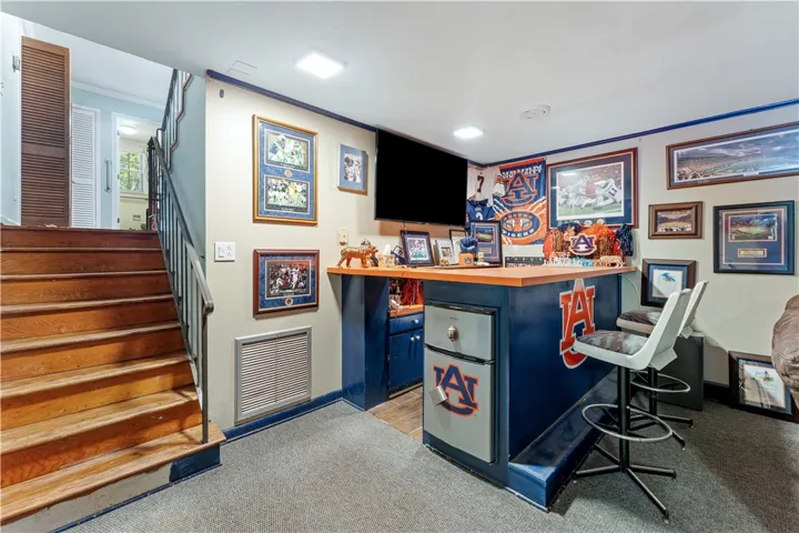 A casual lower level with a fully equipped bar, ready for entertaining.