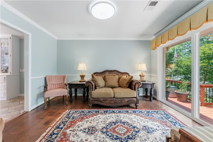 Hardwood floors and soft blue walls create a welcoming atmosphere.