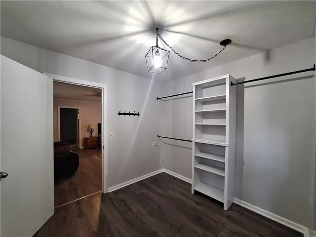 Ample storage solutions define this practical and well-appointed closet space.