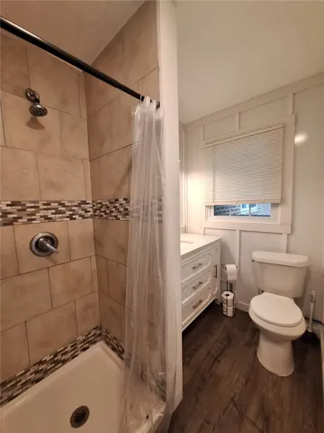 A well-appointed bathroom with contemporary fixtures and durable flooring.