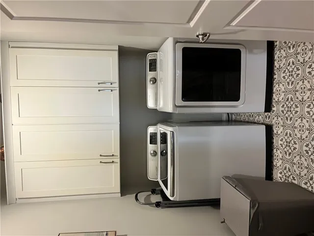 Functional utility space with built-in cabinetry and modern appliances.