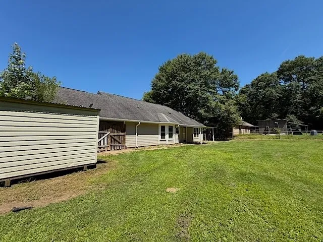 A spacious yard provides ample room for outdoor activities, complementing the house's exterior.