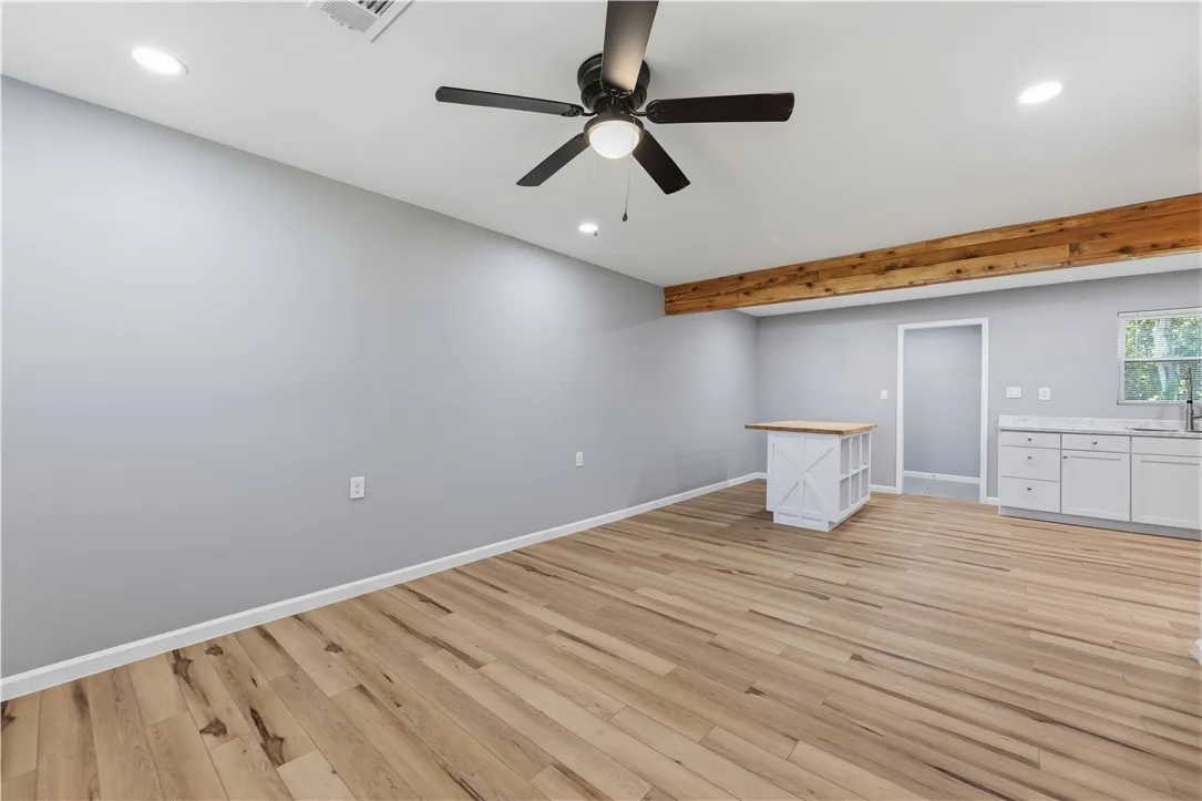 A well-lit area showcasing durable flooring and functional kitchen elements.