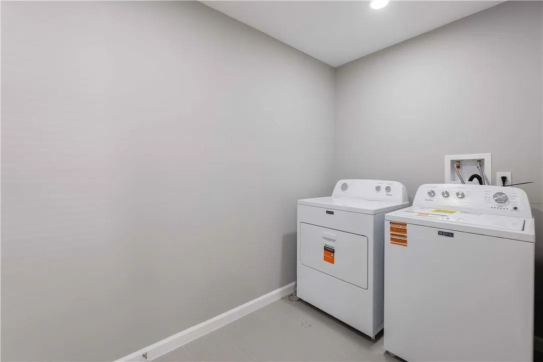 Functional utility space with modern appliances to streamline household chores.