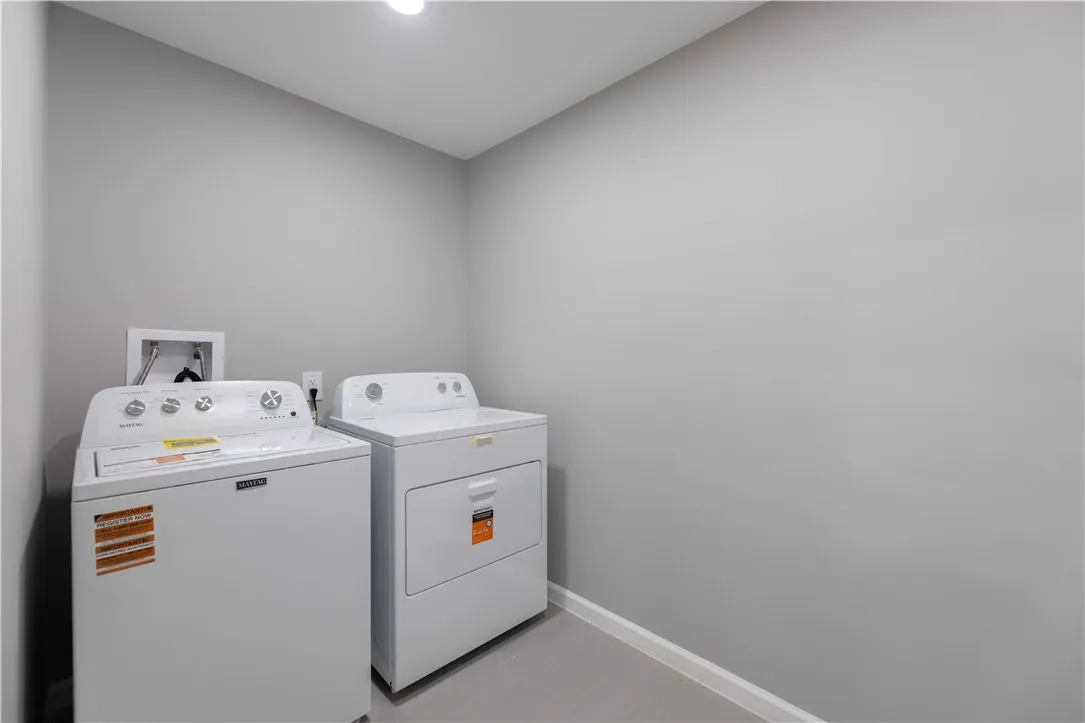 Equipped with essential laundry appliances, this dedicated utility space streamlines household chores.