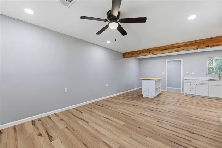 A well-lit area showcasing durable flooring and functional kitchen elements.