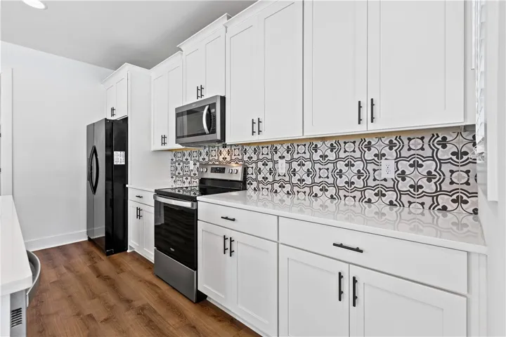 A well-equipped kitchen showcasing modern appliances and stylish cabinetry.