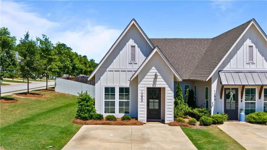 A well-maintained facade with neat landscaping offers inviting curb appeal.