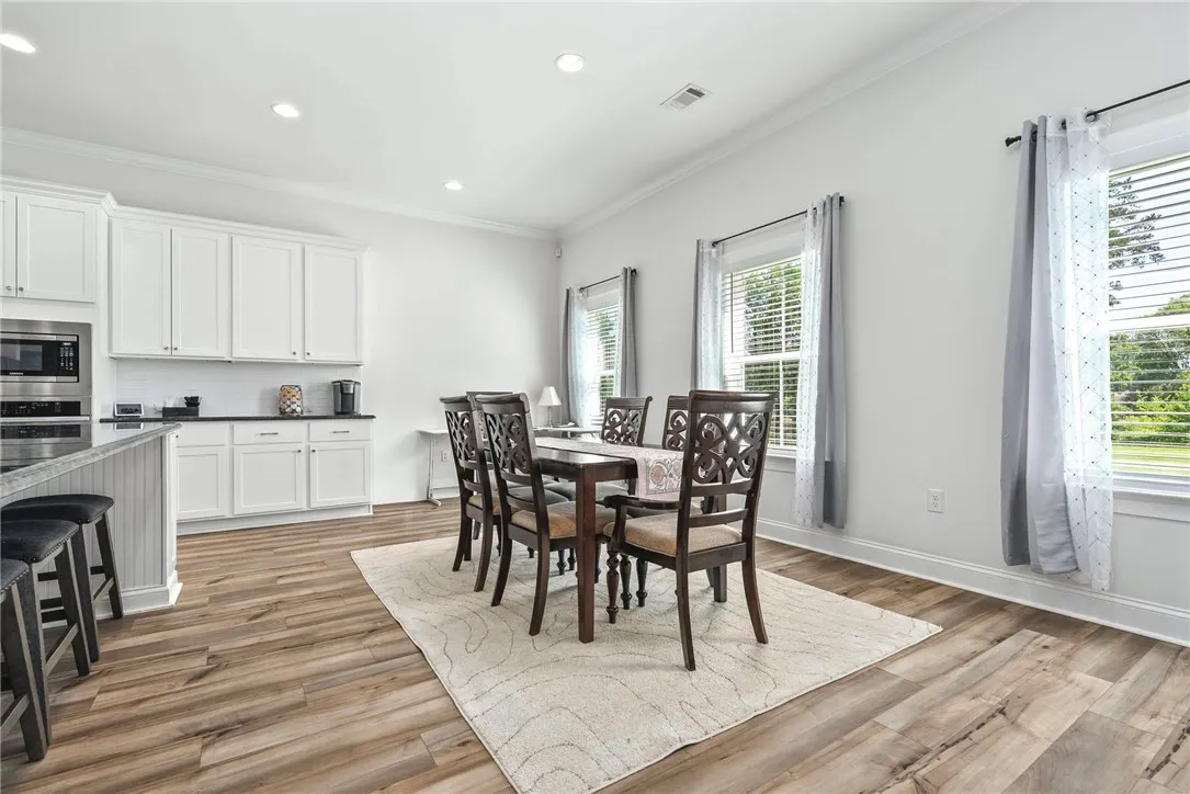 An open concept kitchen and dining area provides flexible space for daily living.