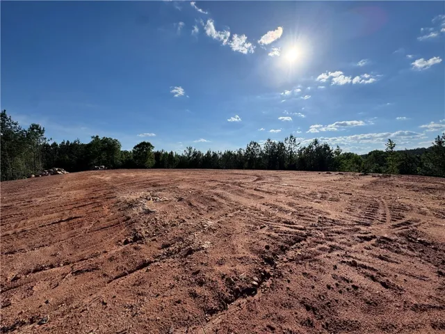 A cleared, level lot offers an ideal foundation for a future home.