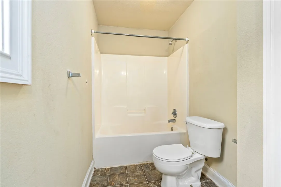 A well-maintained bathroom with a combination shower and tub.