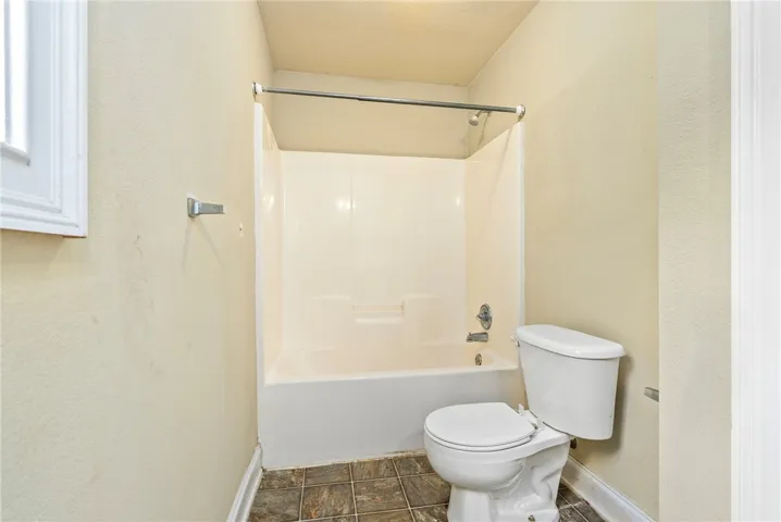 A well-maintained bathroom with a combination shower and tub.