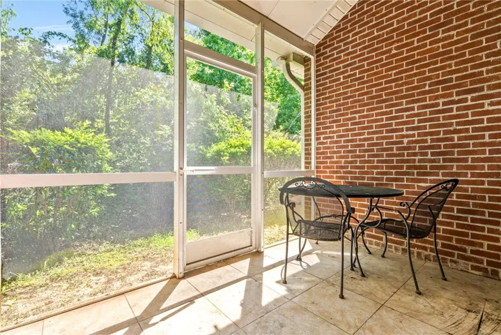 A tranquil screened porch, perfect for enjoying quiet moments amidst nature's embrace.