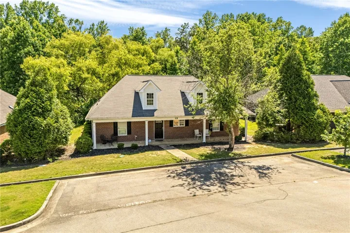 A classic brick exterior with white columns and dormer windows welcomes you home.