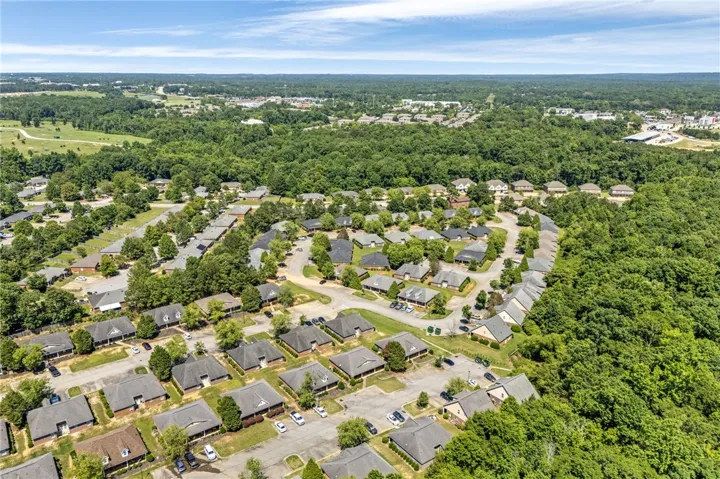 An aerial perspective reveals a harmonious community nestled amidst a verdant landscape.