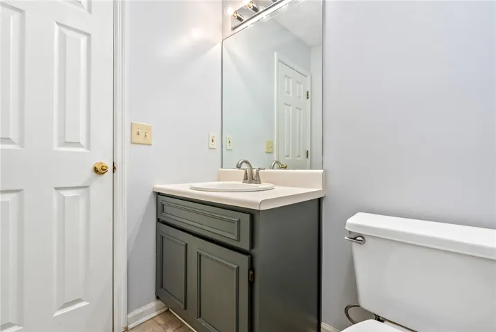 A well-maintained bathroom vanity and mirror offer everyday convenience and style.