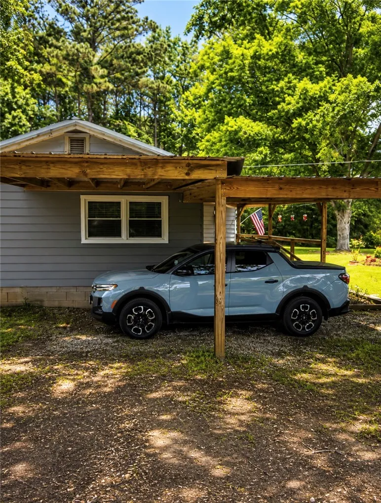 Attached single car port