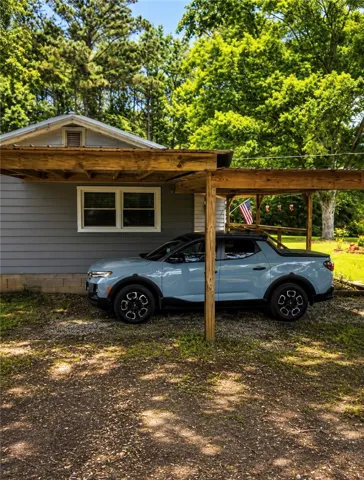 Attached single car port