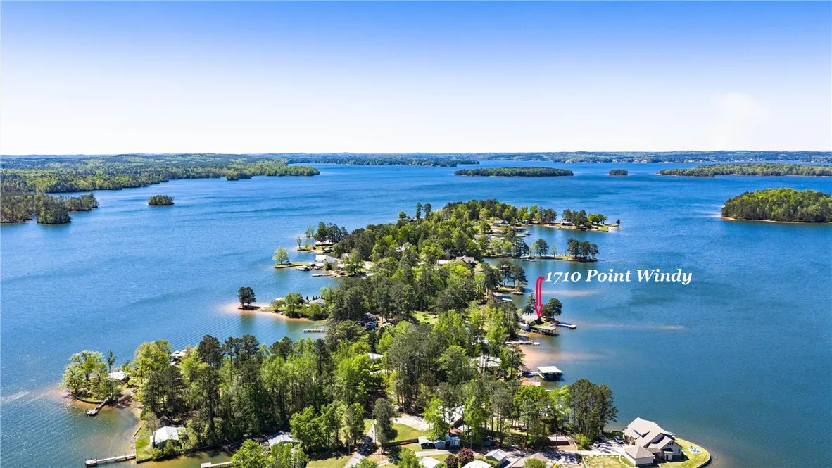 Discover a tranquil lakeside escape, with verdant islands dotting the shimmering water.