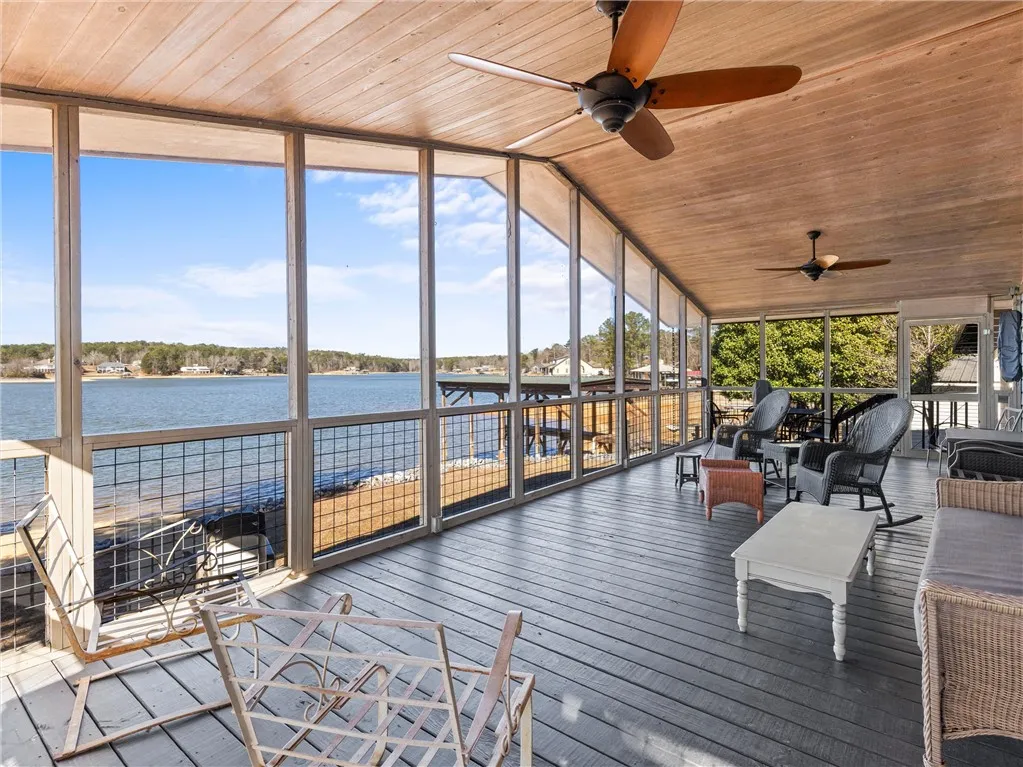 An enclosed porch provides scenic lakefront views and a peaceful retreat.