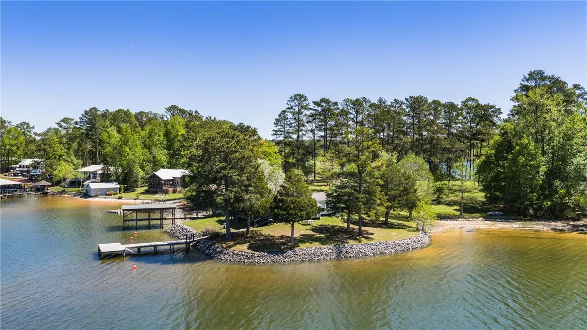 Boasting waterfront access, this wooded lot offers private dock facilities and sandy shoreline.