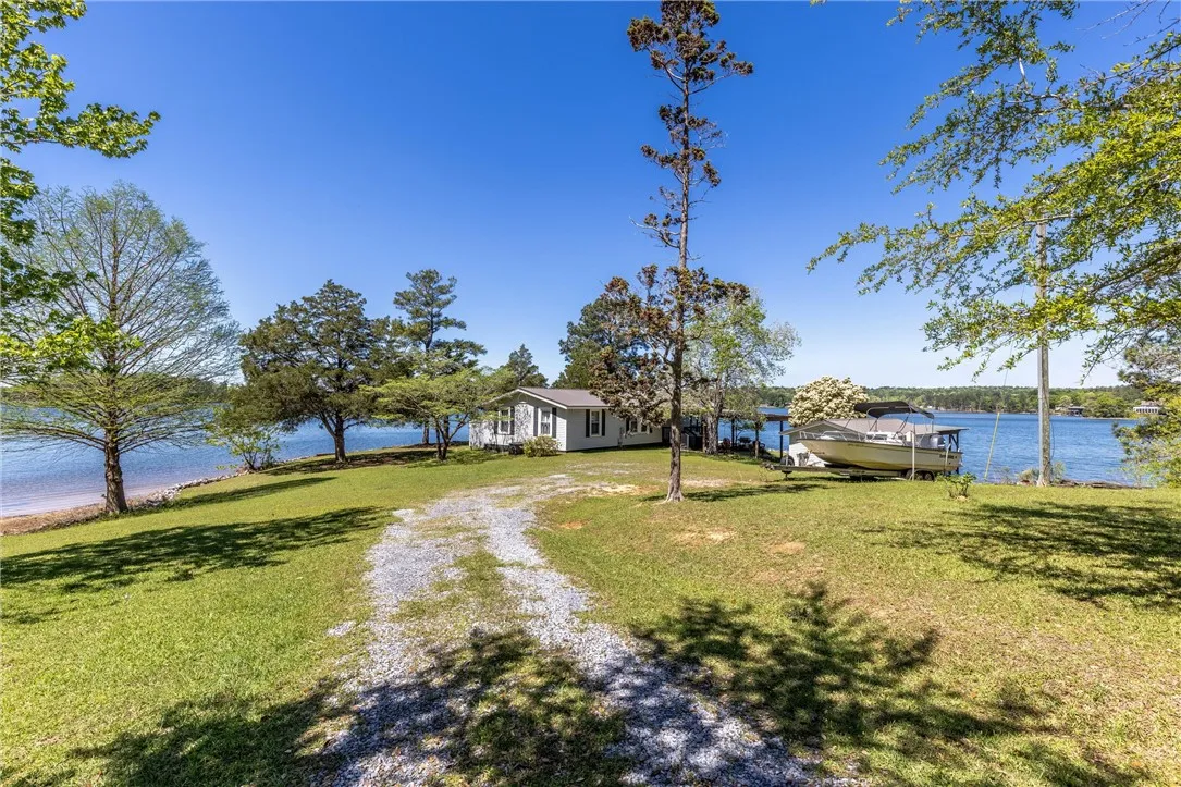 A tranquil lakefront property awaits with a private dock and direct water access.