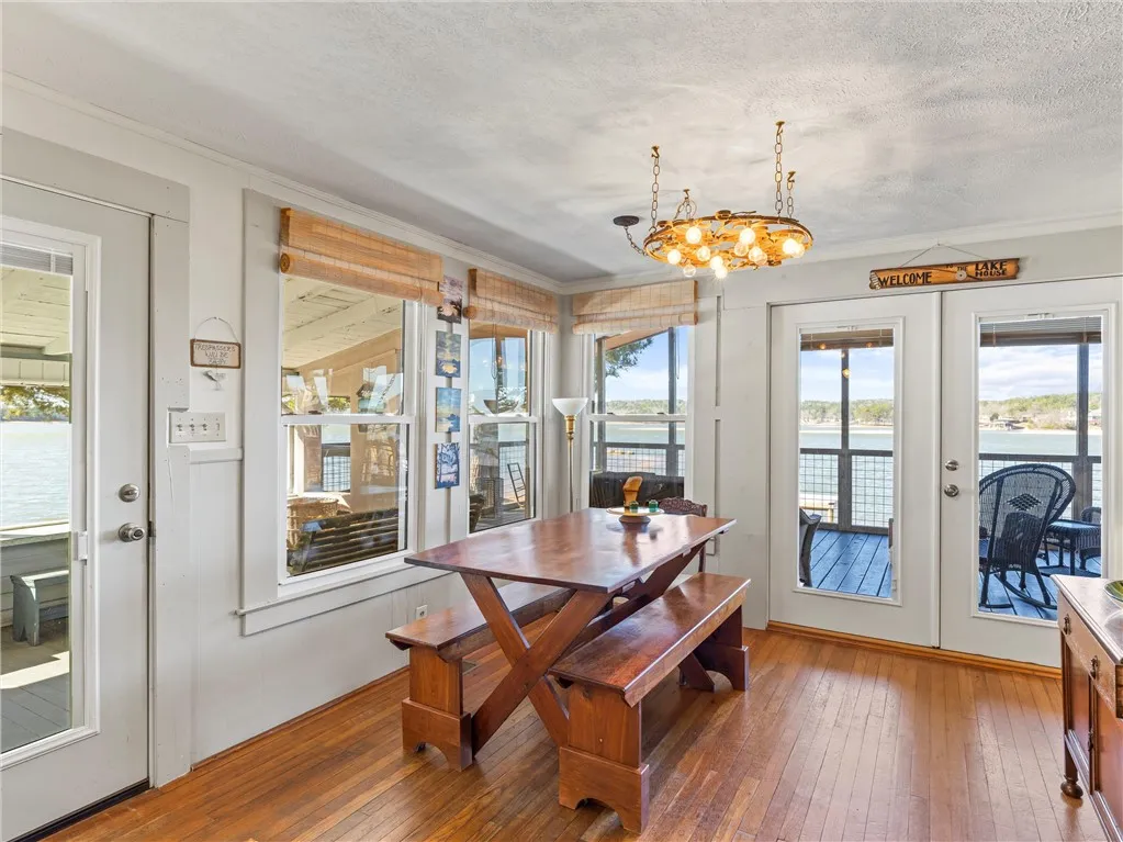 Lakeside dining area with wide-reaching lake views and easy deck access.