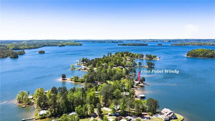 Discover a tranquil lakeside escape, with verdant islands dotting the shimmering water.