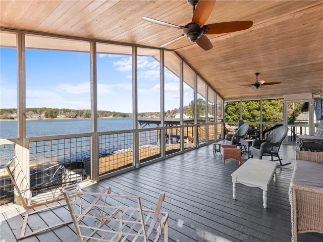An enclosed porch provides scenic lakefront views and a peaceful retreat.
