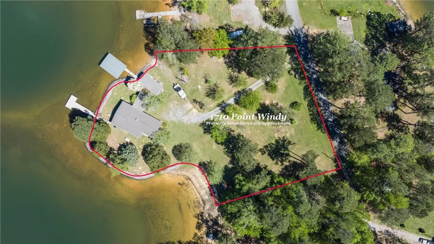 Discover this exceptional waterfront property featuring a private dock and ample green space for outdoor pursuits.