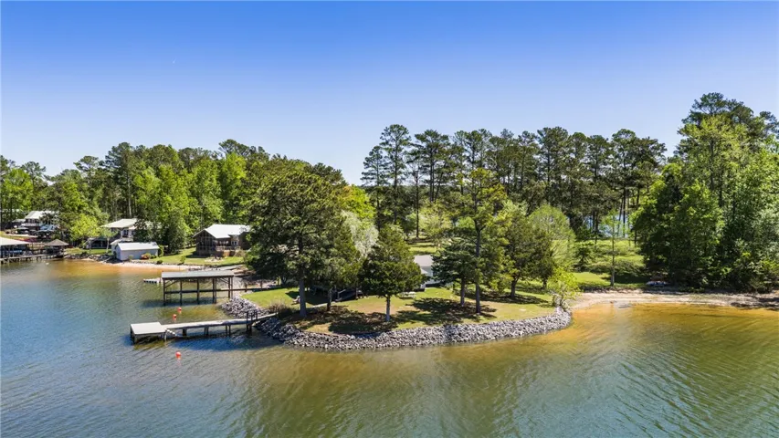 Boasting waterfront access, this wooded lot offers private dock facilities and sandy shoreline.