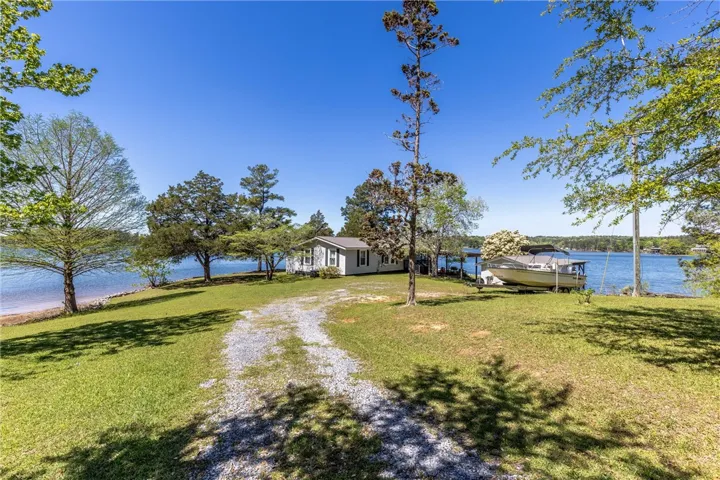 A tranquil lakefront property awaits with a private dock and direct water access.