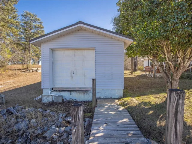 A well-maintained boat house with direct water access offers convenient storage.