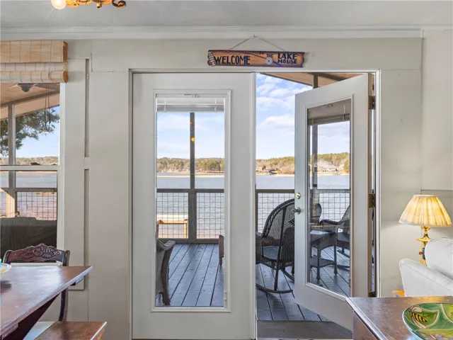 Step out onto the screened porch and savor exceptional lake views.