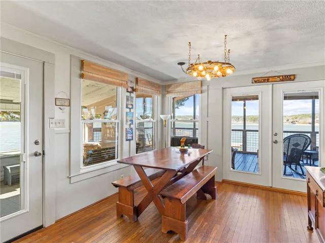 Lakeside dining area with wide-reaching lake views and easy deck access.